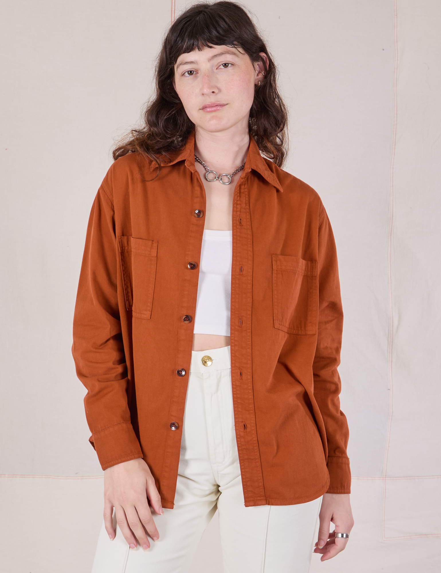 Alex is wearing Twill Overshirt in Burnt Terracotta