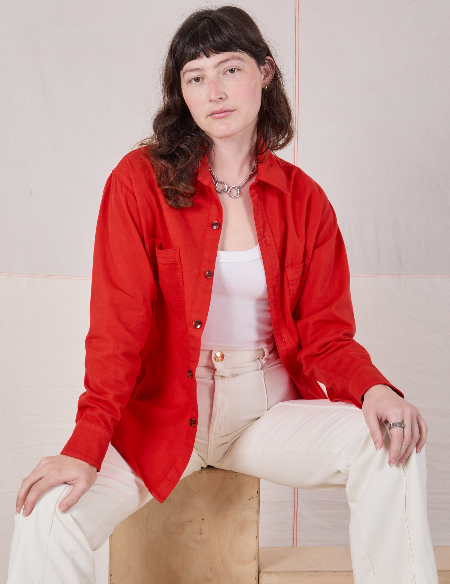 Twill Overshirt in Mustang Red and vintage tee off-white Western Pants worn by Alex