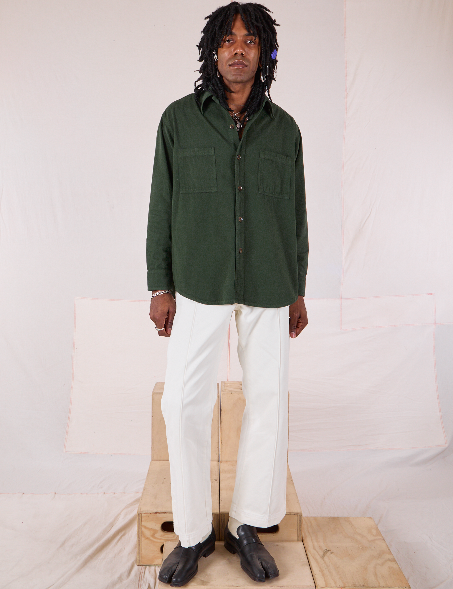 Jerrod is wearing Twill Overshirt in Swamp Green and vintage tee off-white Western Pants