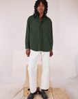 Jerrod is wearing Twill Overshirt in Swamp Green and vintage tee off-white Western Pants