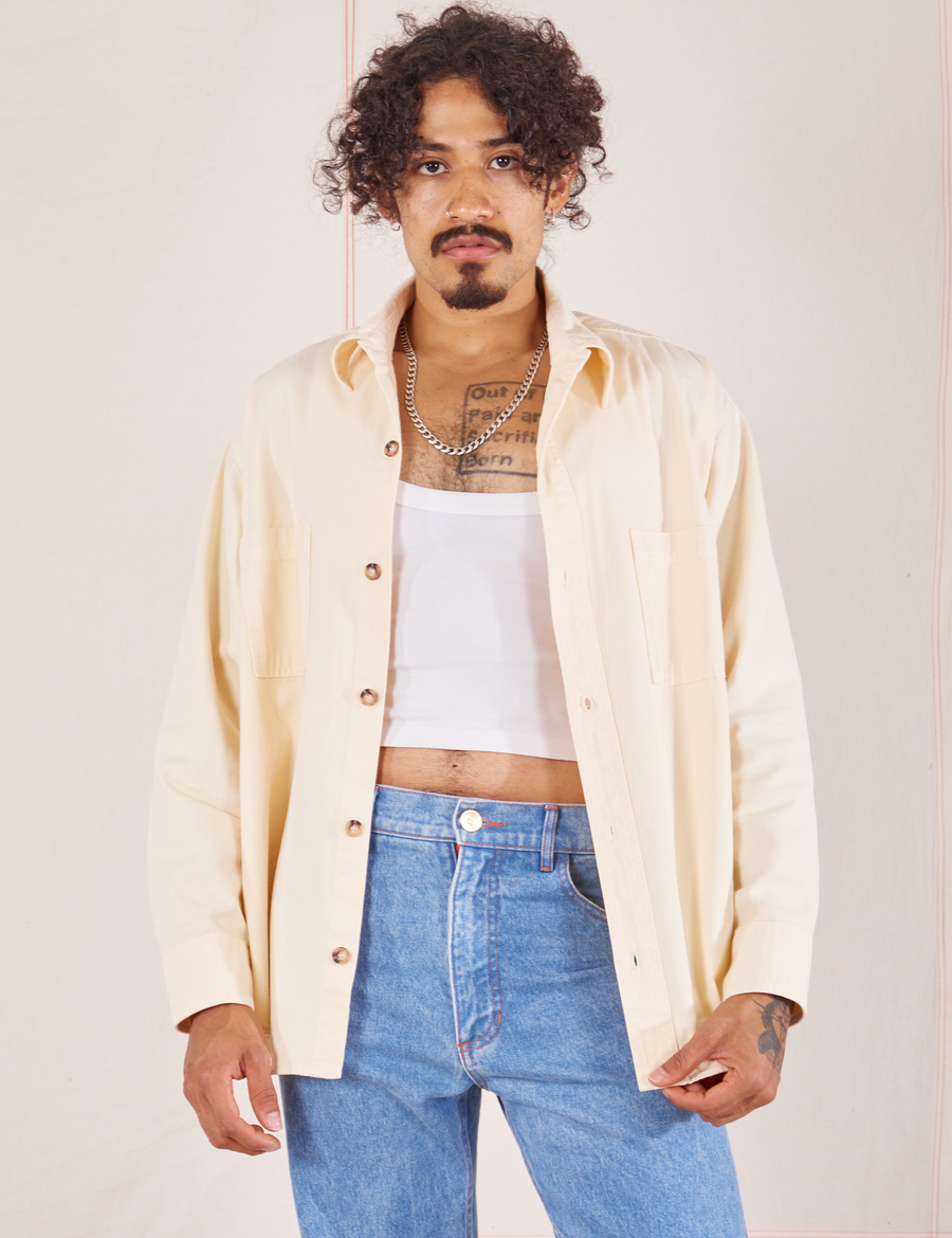 Jesse is wearing Oversize Overshirt in Vintage Off-White and a vintage off-white Cropped Tank Top underneath