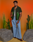 Paintstamped Pantry Button-Up in Cactus and light wash Indigo Wide Leg Trousers on Jesse