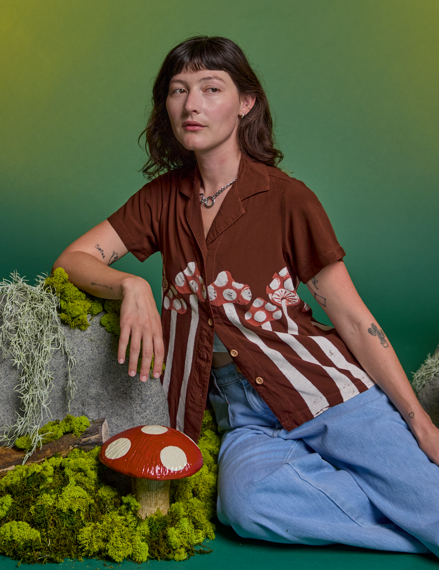 Alex is wearing Paintstamped Pantry Button-Up in Mushroom