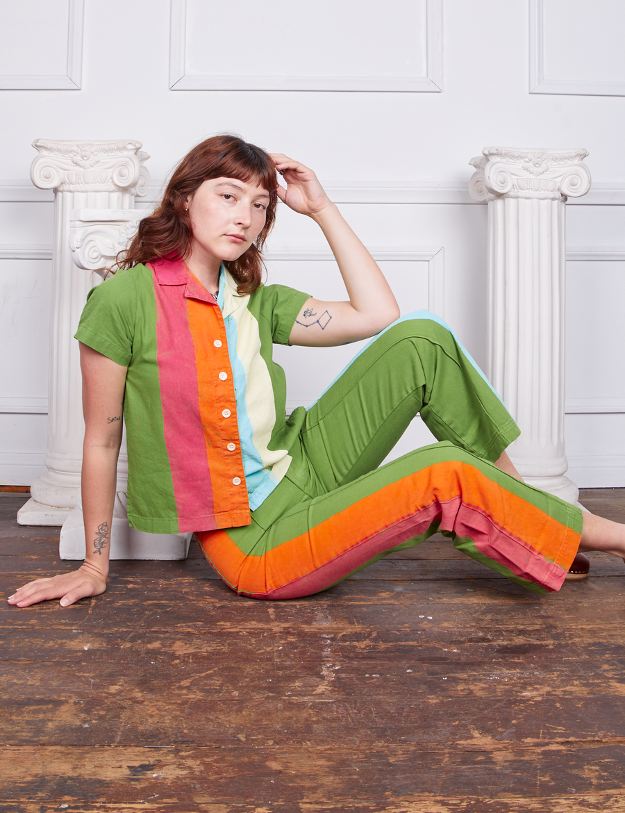 Alex is wearing Hand-Painted Stripe Western Pants in Bright Olive and matching Pantry Button-Up