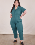 Ashley is 5’7” and wearing 1XL Petite Short Sleeve Jumpsuit in Marine Blue