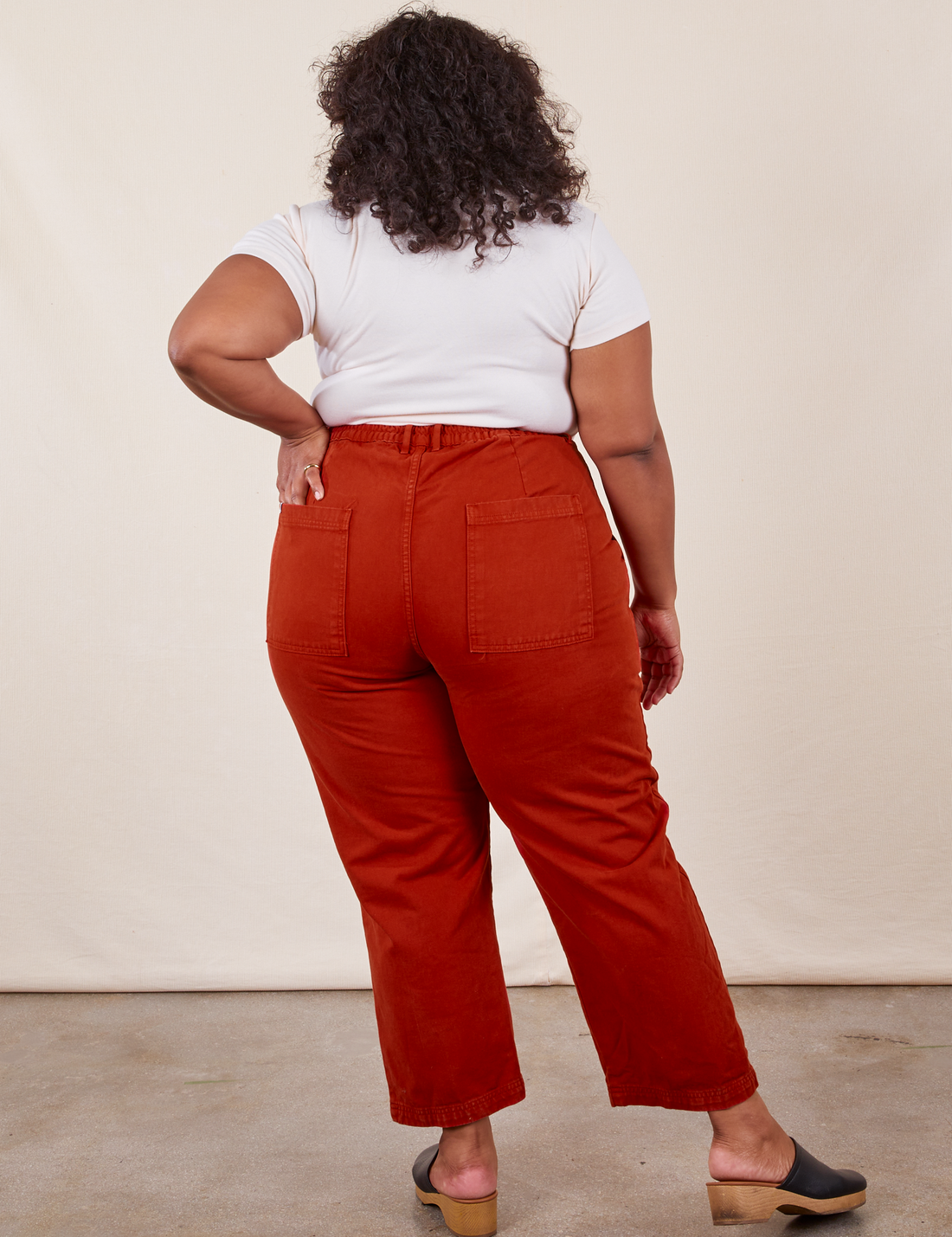 Work Pants in Paprika back view on Morgan wearing a vintage off-white Baby Tee