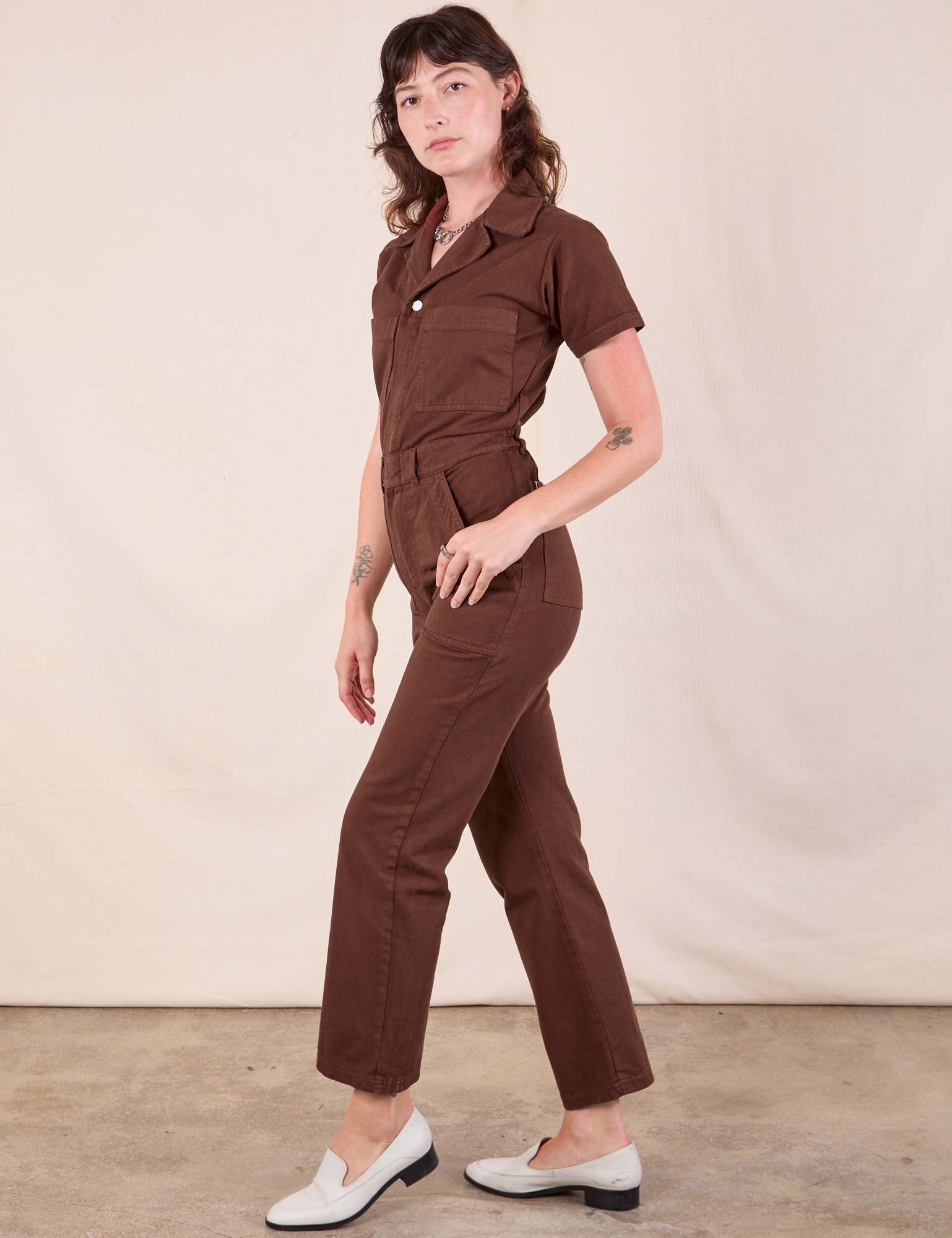 Short Sleeve Jumpsuit in Fudgesicle Brown side view on Alex