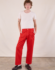 Quinn is 6’4” and wearing M Work Pants in Mustang Red and Burly Tee in Vintage Tee Off-White