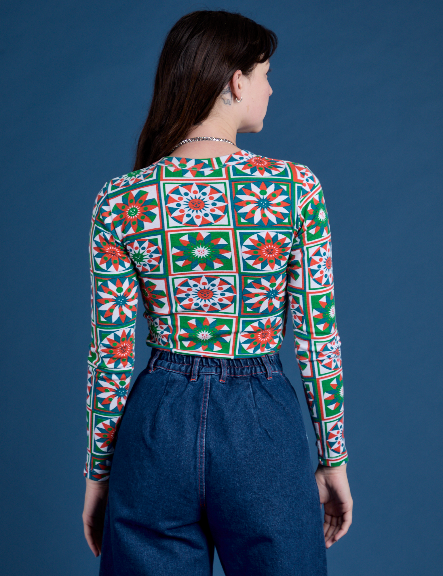 Long Sleeve Baby Tee in Quilt Print back view on Alex