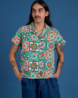 Anthony is wearing a buttoned up Quilt Print Pantry Button-Up