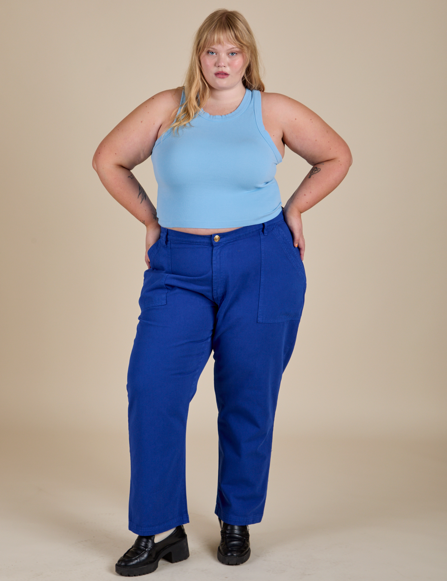 Juliet is wearing  Racerback Tank in Baby Blue and Work Pants in Royal Blue