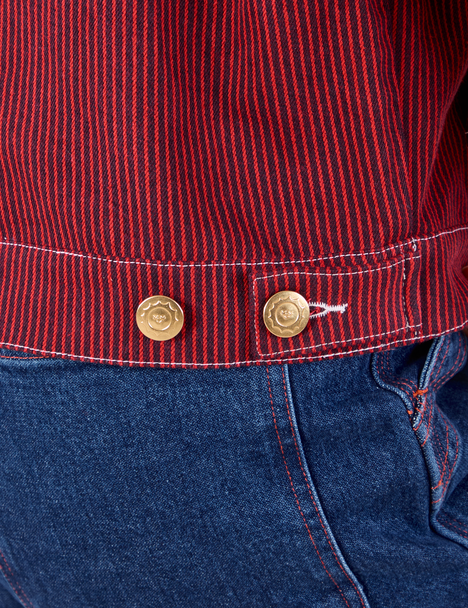 Mechanic Jacket in Mustang Red custom brass button close up