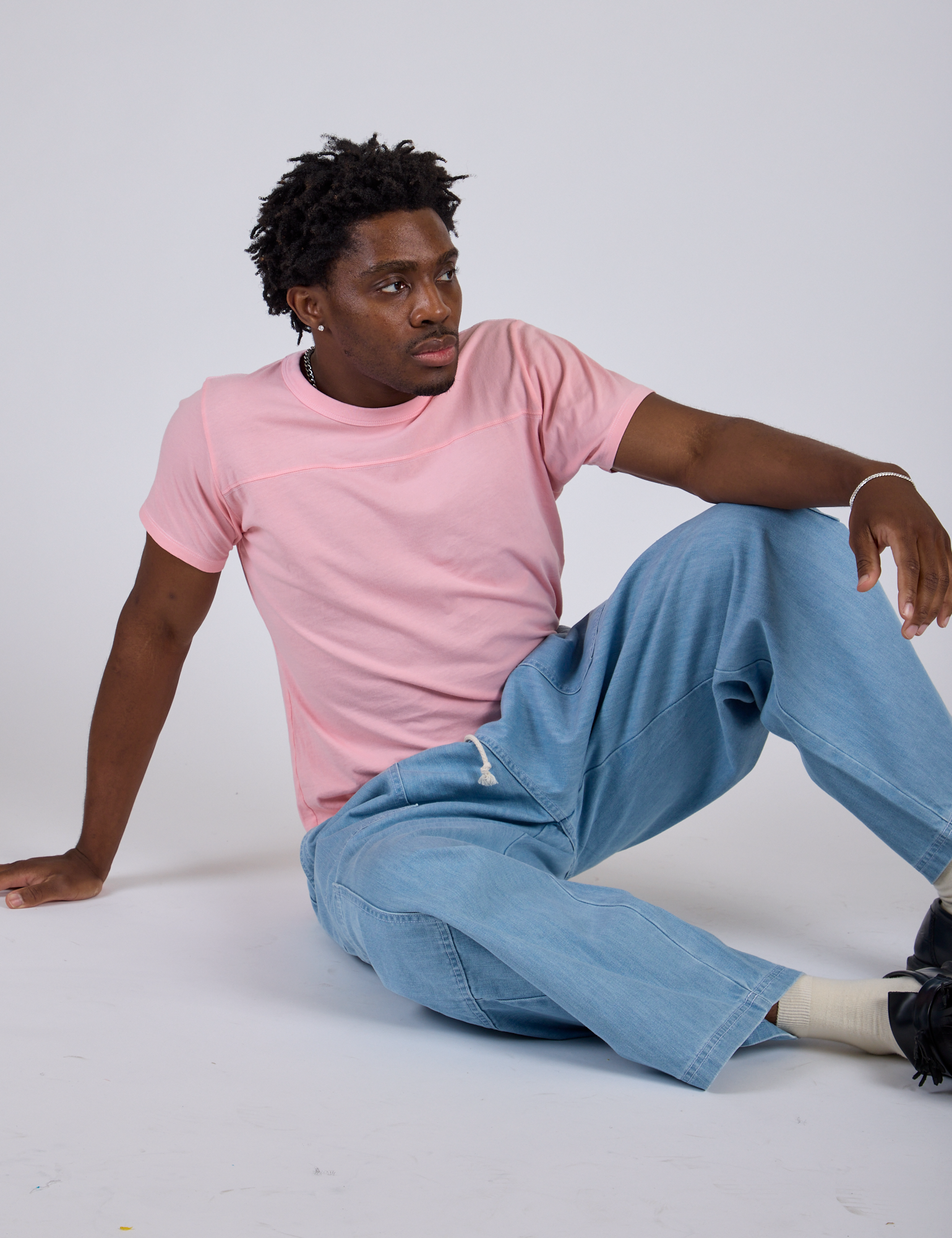 Jr. Varsity Tee in Baby Pink and light wash Denim Drop Pocket Pants on Isaac