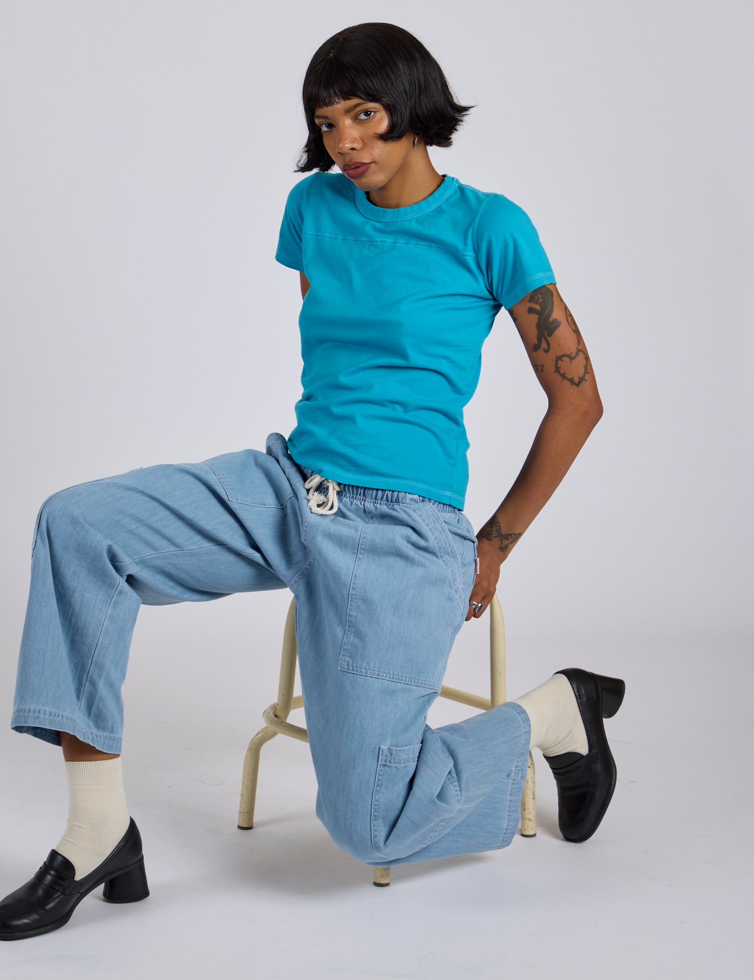Jr. Varsity Tee in Hawaiian Blue and light wash Denim Drop Pocket Pants on Kira
