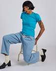Jr. Varsity Tee in Hawaiian Blue and light wash Denim Drop Pocket Pants on Kira