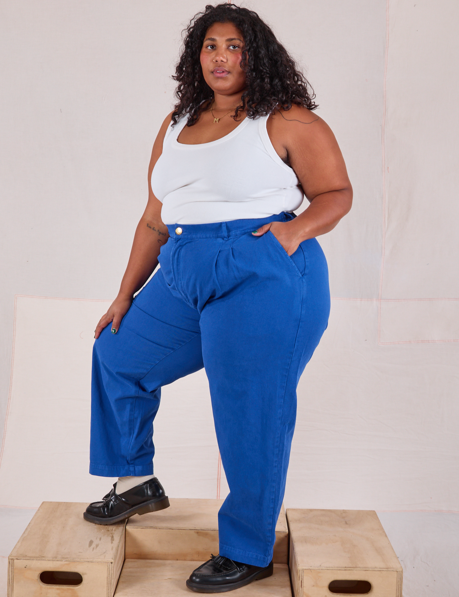 Angled front view of Heavyweight Trousers in Royal Blue and Cropped Tank in Vintage Tee Off-White