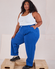 Angled front view of Heavyweight Trousers in Royal Blue and Cropped Tank in Vintage Tee Off-White