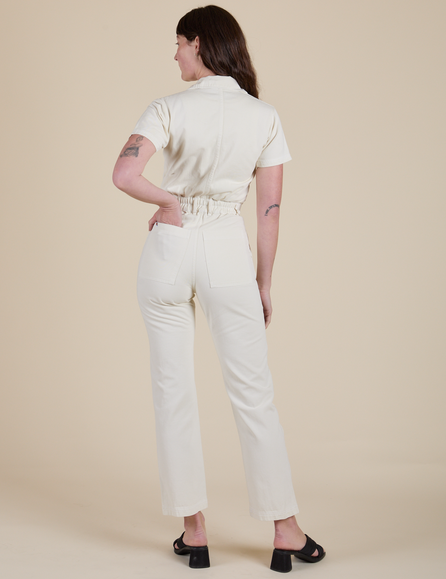 Short Sleeve Jumpsuit in Vintage Tee White back view on Alex