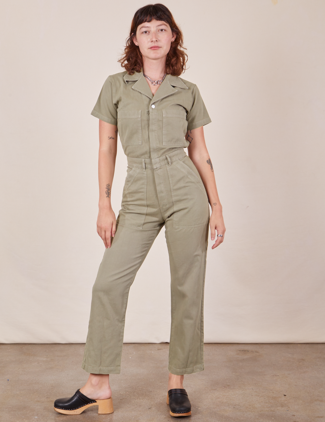 Alex is 5'8" and wearing XS Short Sleeve Jumpsuit in Khaki Grey