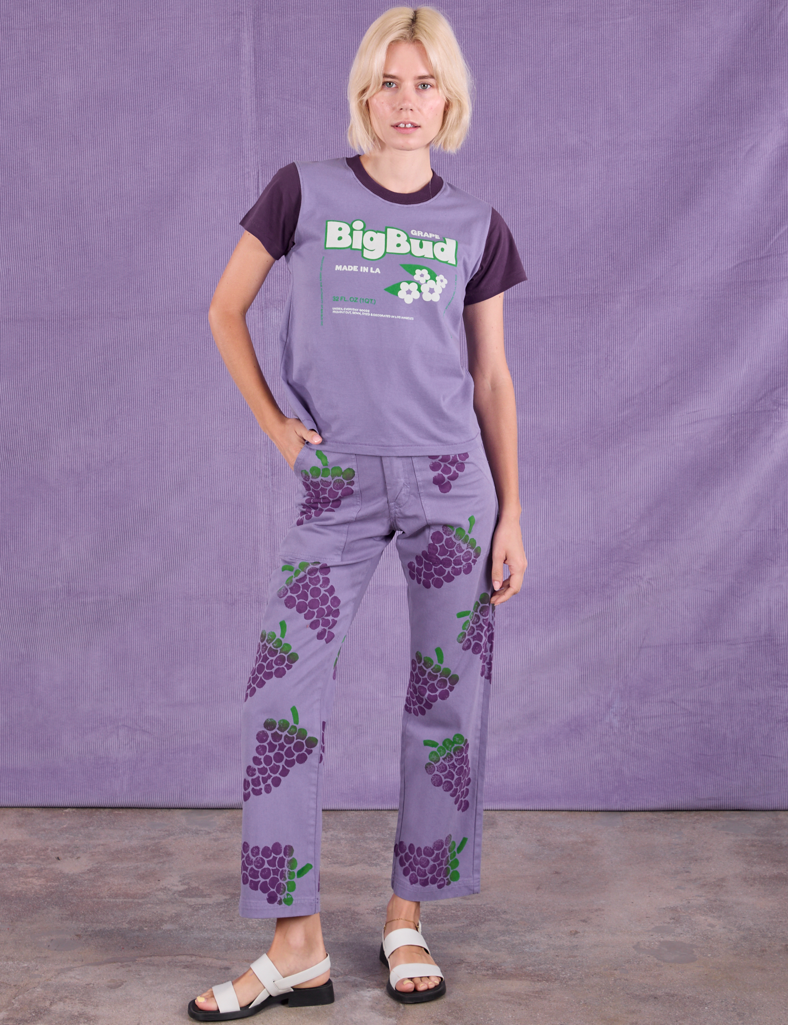 Madeline is wearing Vintage Tee in Grape Soda and Paintstamped Work Pants in Grape