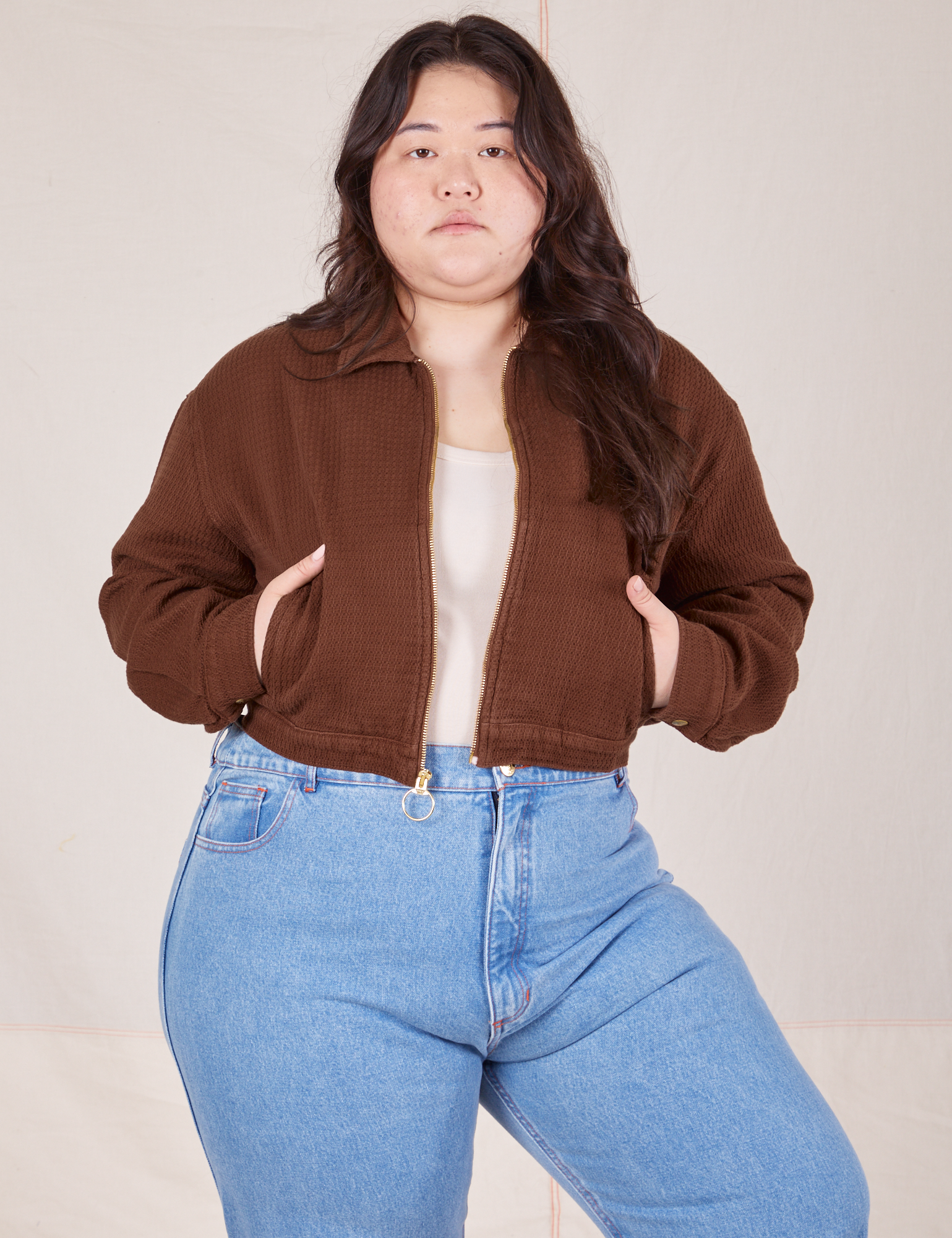 Ashley is 5&#39;7&quot; and wearing L Ricky Jacket in Fudgesicle Brown paired with a vintage off-white Tank Top and Big Bud Press denim pants
