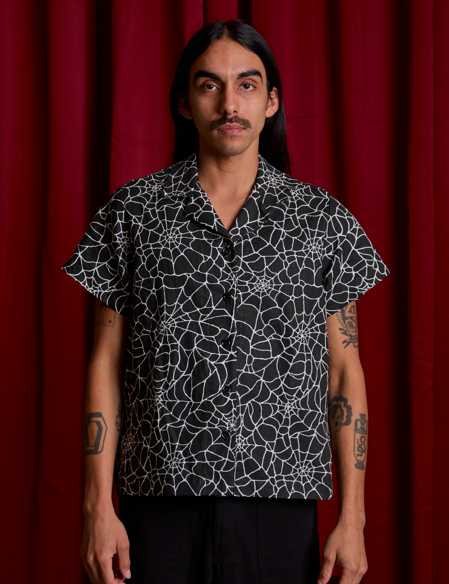 Anthony is wearing Spider Webs Pantry Button-Up