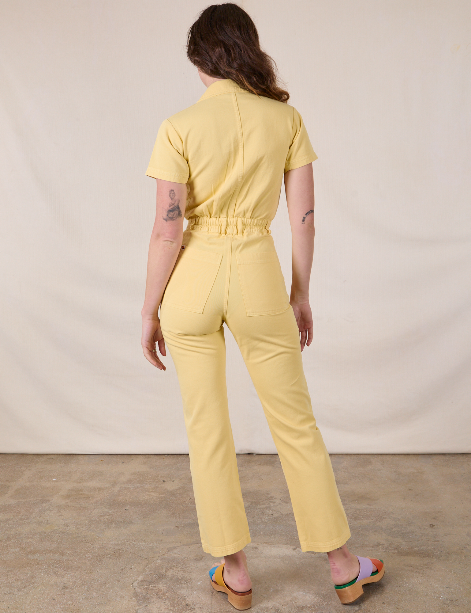 Short Sleeve Jumpsuit in Butter Yellow back view on Alex