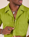 Short Sleeve Jumpsuit in Gross Green front close up on Issac