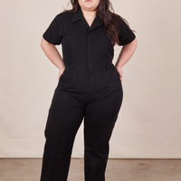 Ashley is 5'7" and wearing 1XL Short Sleeve Jumpsuit in Basic Black
