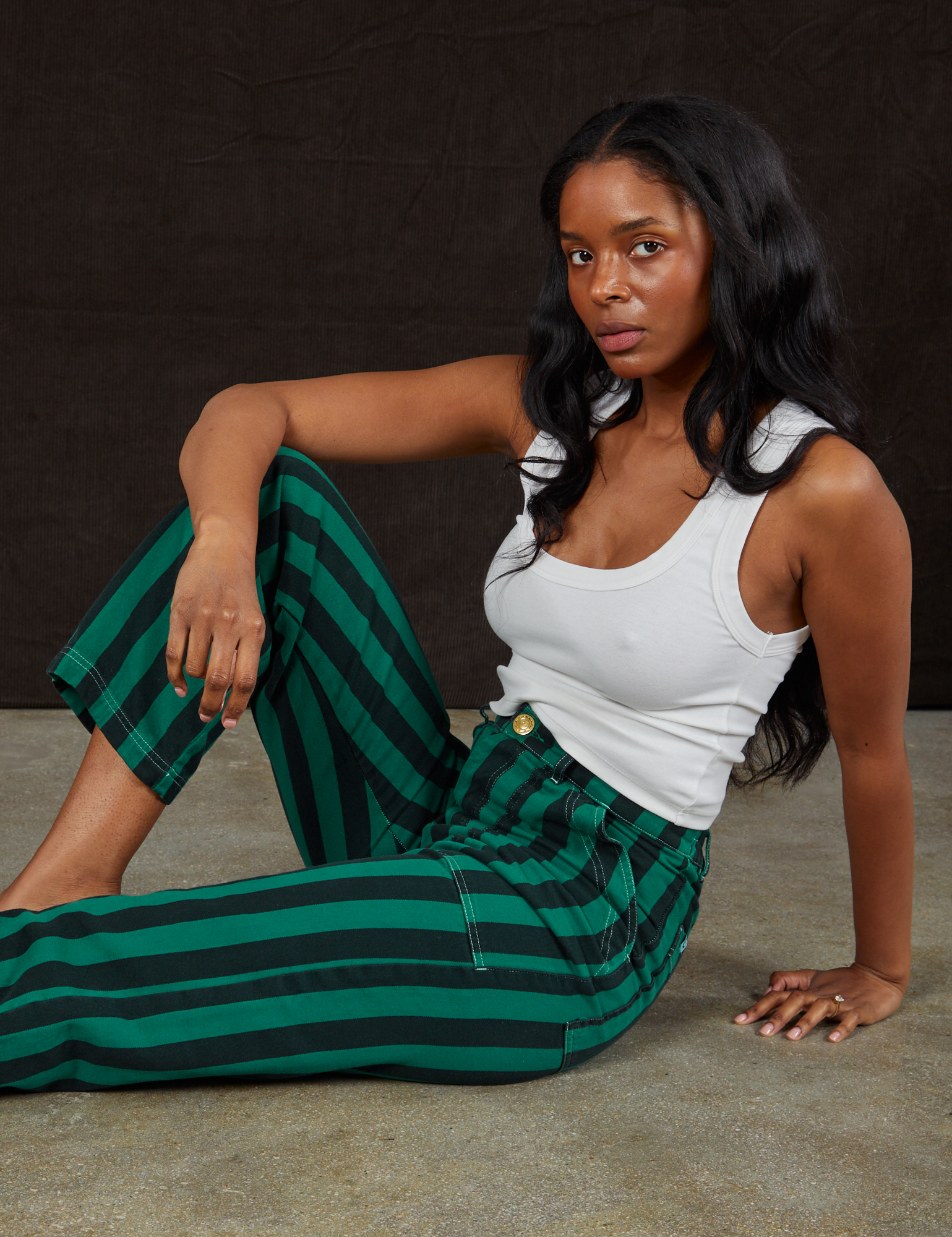 Kandia is wearing Black Stripe Work Pants in Hunter and vintage off-white Cropped Tank Top