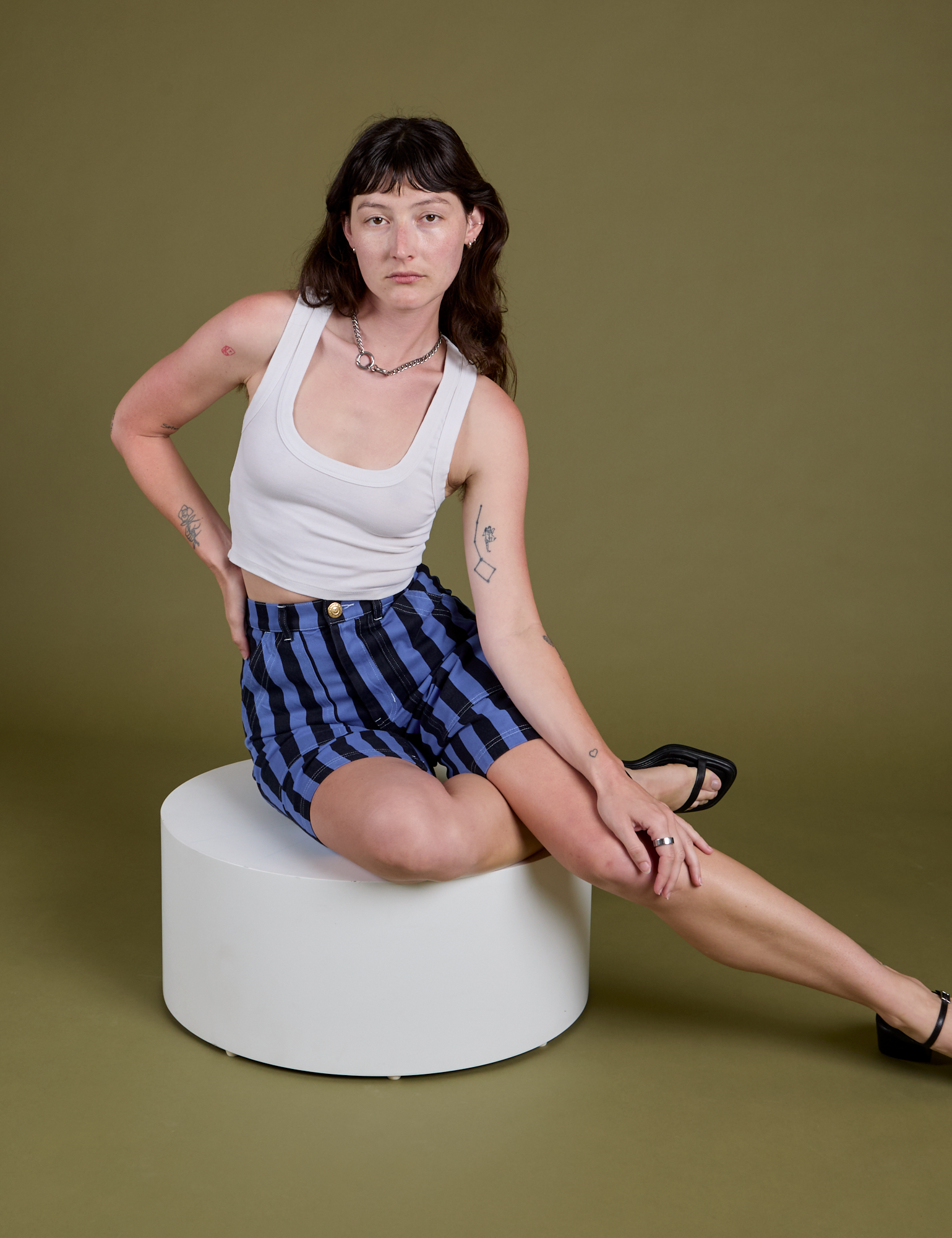 Alex is wearing Longline Work Shorts in Cornflower and Cropped Tank in Vintage Tee White