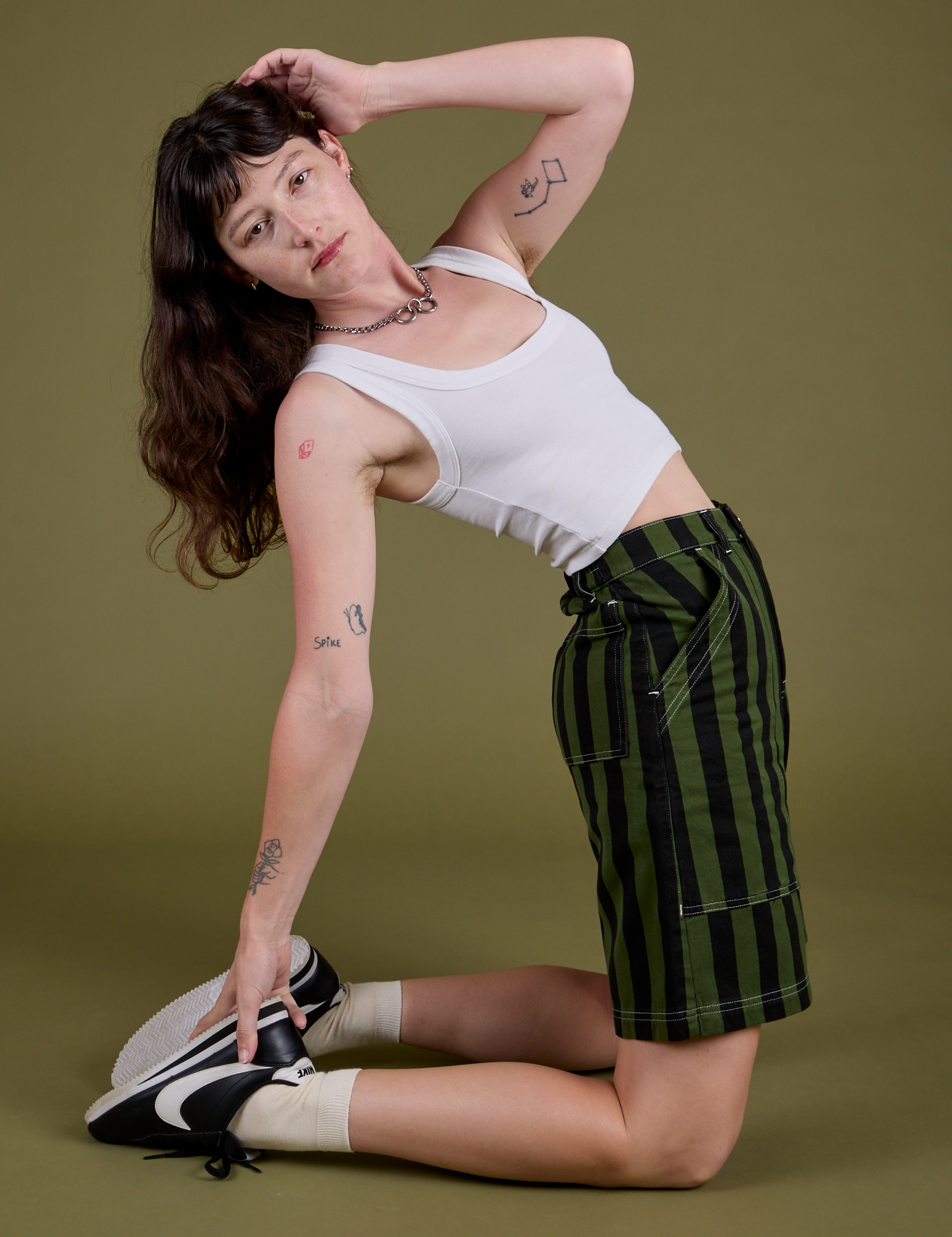 Longline Work Shorts in Evergreen and Cropped Tank in Vintage Tee White worn by Alex