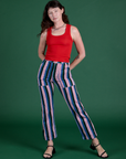 Alex is 5’8” and wearing XXS Work Pants in Pacific Stripe paired with mustang red Cropped Tank