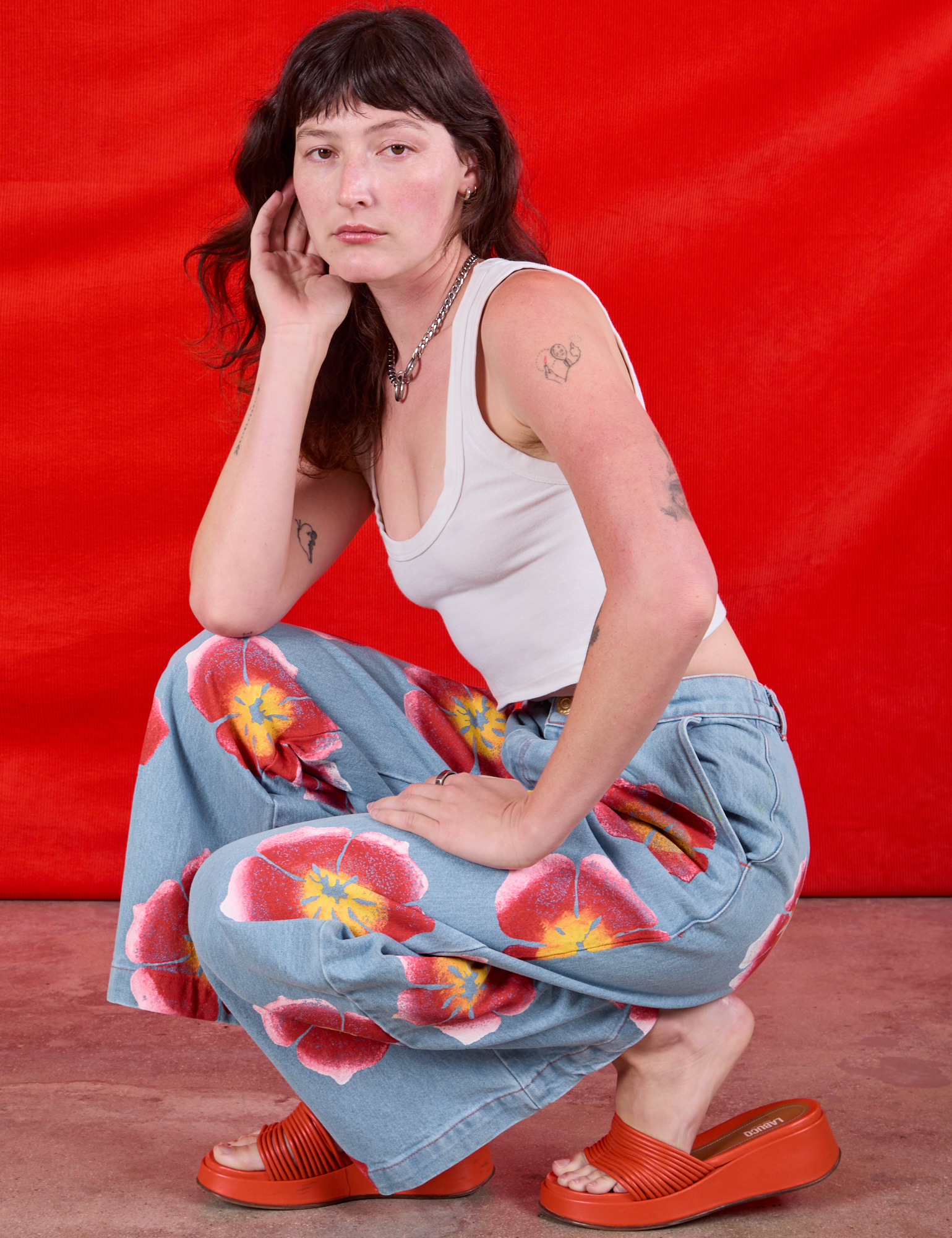 Alex is wearing Wide Leg Denim Trousers in Painted Flowers and Cropped Tank in Vintage Tee Off-White