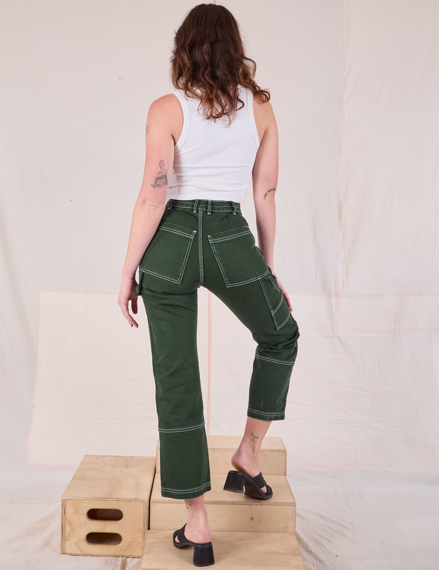 Carpenter Jeans in Swamp Green back view on Alex