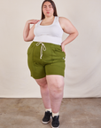 Marielena is 5’8” and wearing 2XL Lightweight Sweat Shorts in Summer Olive paired with a Cropped Tank in vintage tee off-white