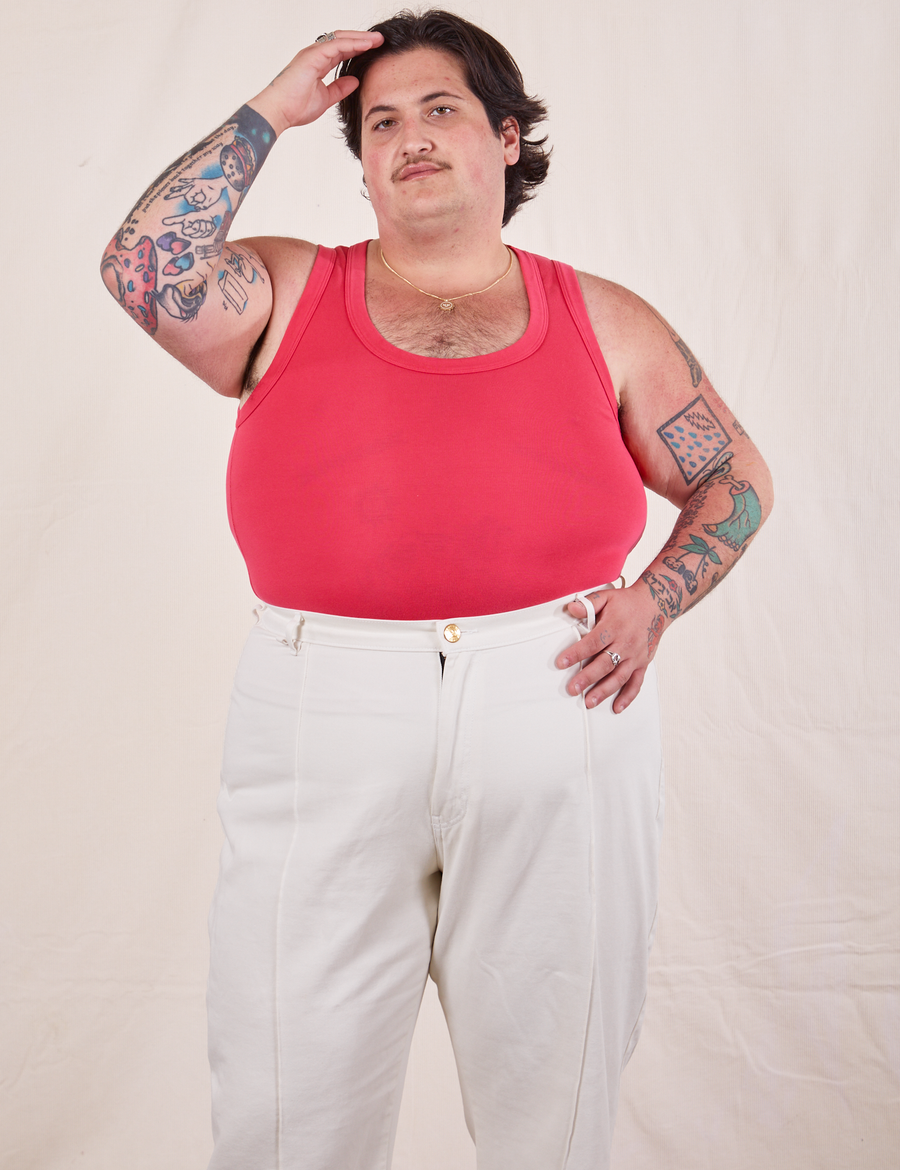 Sam is wearing XL Tank Top in Hot Pink paired with vintage off-white Western Pants