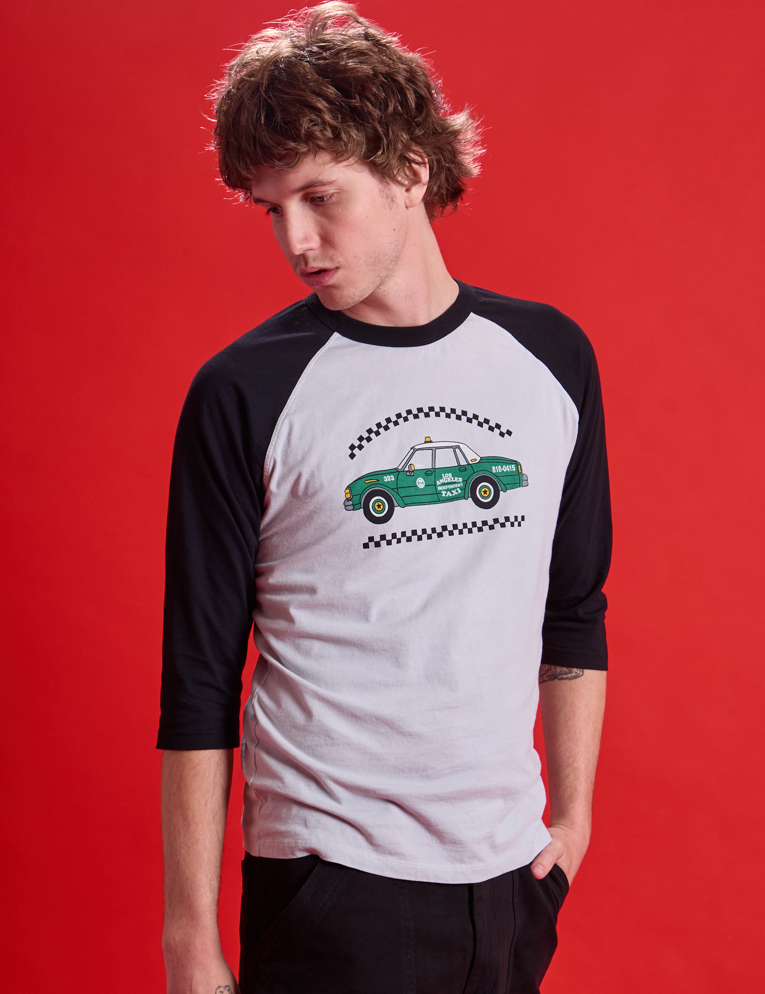 Taxi Raglan Tee in Los Angeles angled front view on Quinn