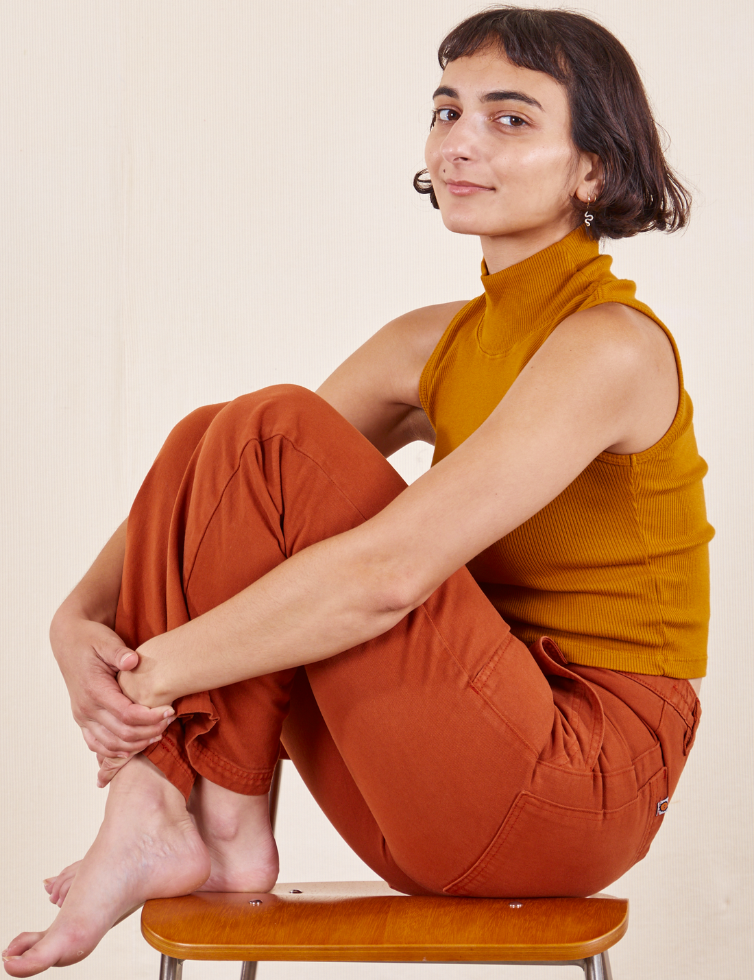 Work Pants in Burnt Terracotta on Soraya wearing spicy mustard Sleeveless Essential Turtleneck