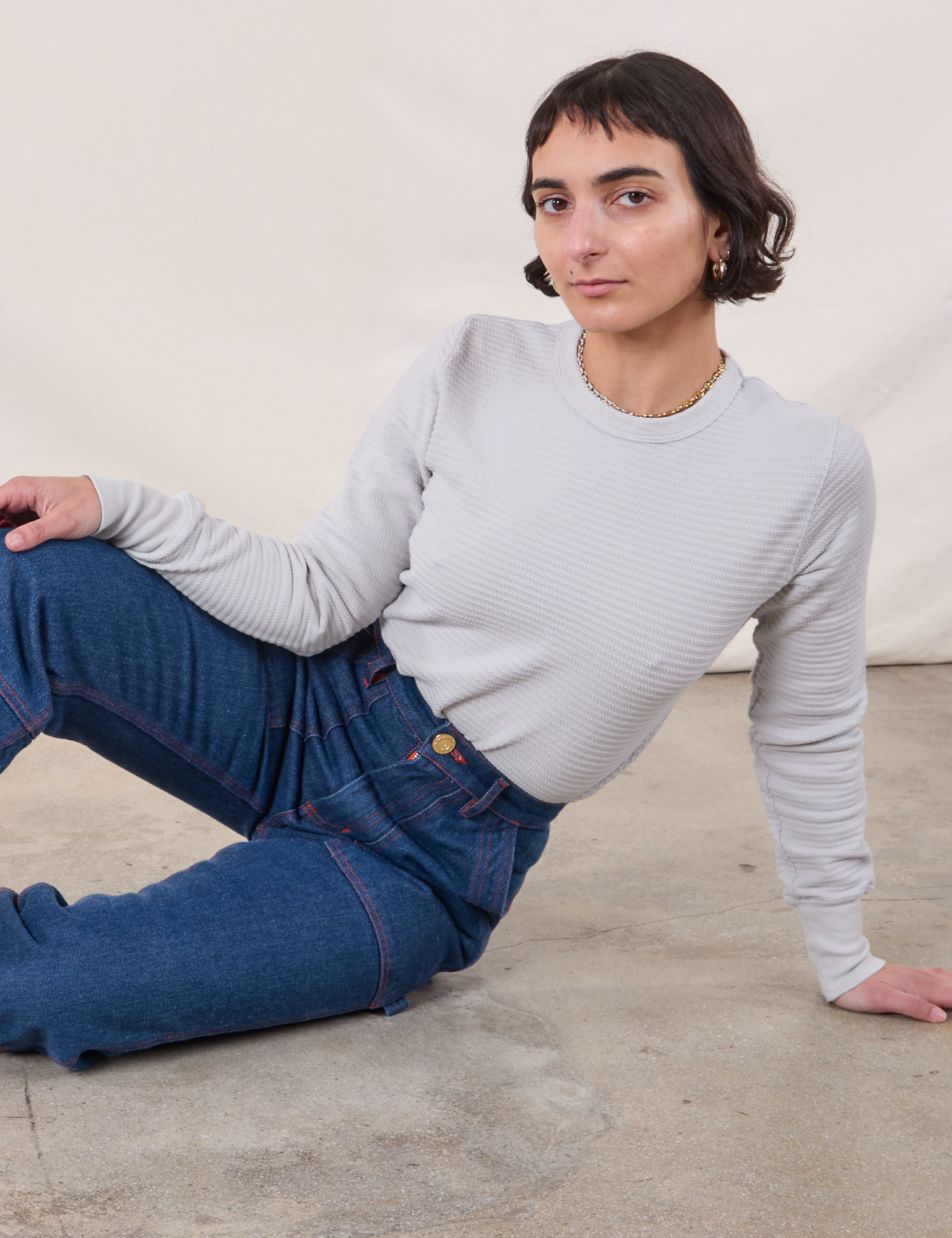 Honeycomb Thermal in Stone White worn by Soraya paired with dark wash Carpenter Jeans