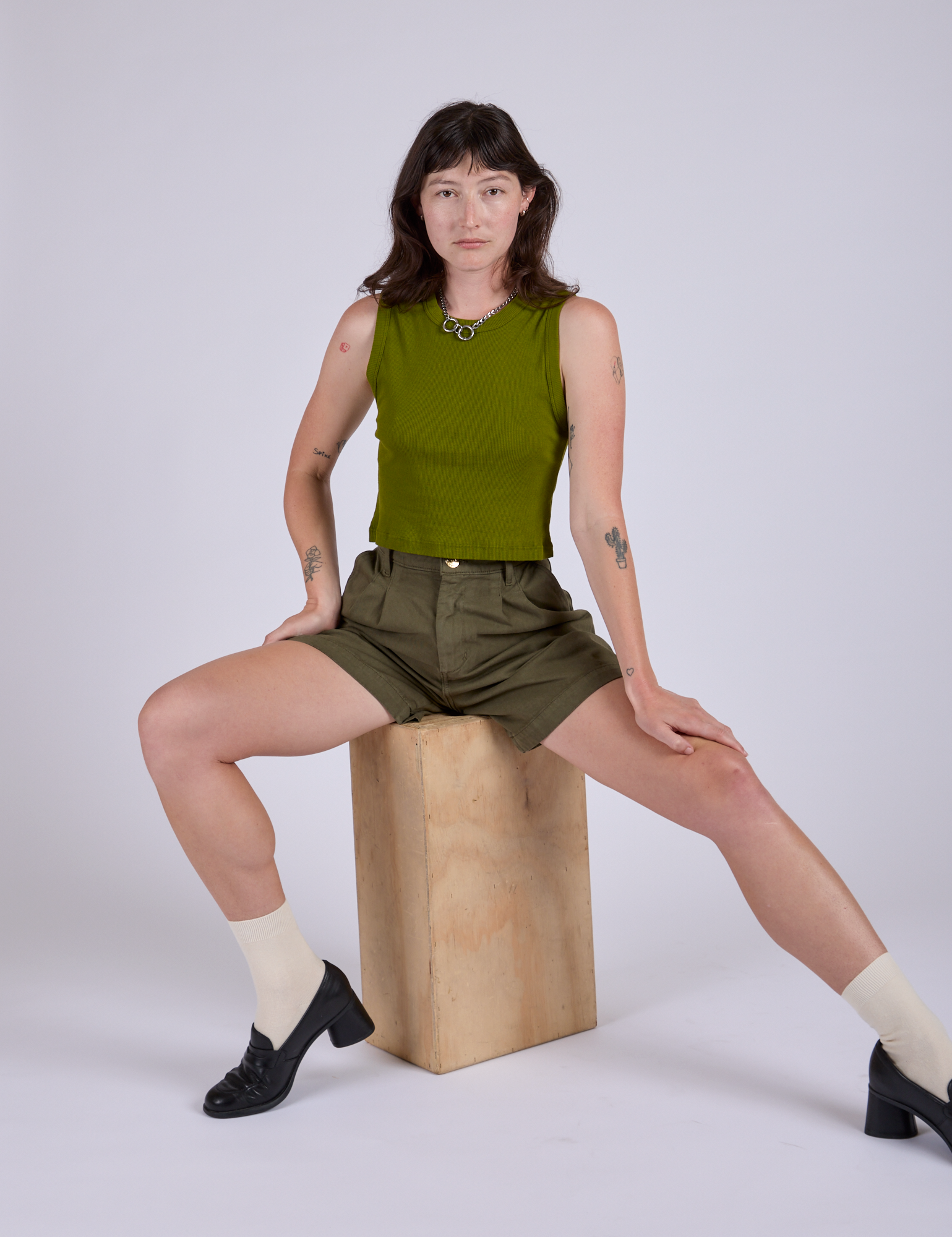 Pleated Trouser Shorts in Surplus Green and muscle tee in Summer Olive worn by Alex