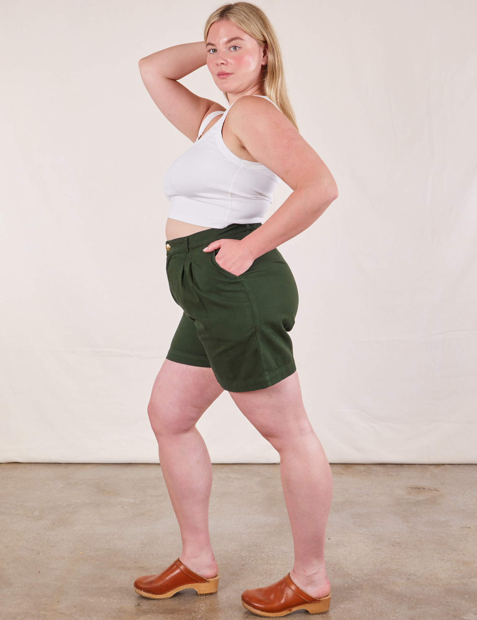Side view of Trouser Shorts in Swamp Green and Cropped Tank in Vintage Tee Off-White on Lish