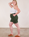 Side view of Trouser Shorts in Swamp Green and Cropped Tank in Vintage Tee Off-White on Lish