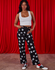 Kandia is 5'3" and wearing XS Paintstamped Heart Work Pants in Black paired with a Cropped Tank in Vintage Tee Off-White