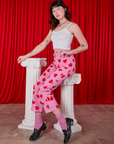 Alex is wearing Paintstamped Heart Work Pants in Bubblegum Pink and Cami in vintage tee off-white