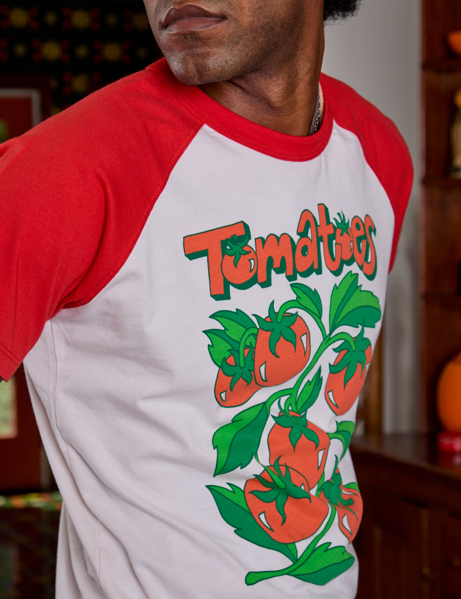 Side view close up of Short Sleeve Raglan Tee in Tomatoes on Jerrod