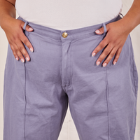 Front view of Western Pants in Faded Grape worn by Alicia. She has both her thumbs in the belt loops.