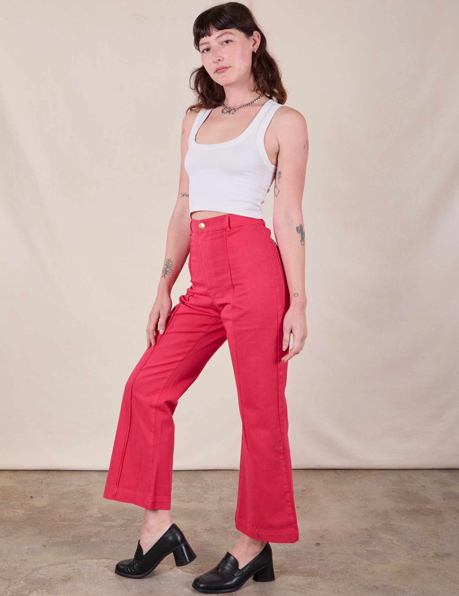 Angled front view of Western Pants in Hot Pink and Cropped Tank in Vintage Tee Off-White