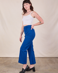 Side view of Western Pants in Royal Blue and Cropped Cami in Vintage Tee Off-White