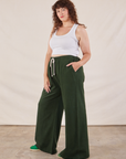 Wide Leg Sweat Pants in Swamp Green side view on Ryan